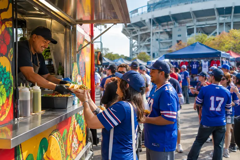 Venue workers preparing concessions before fans arrive for a game